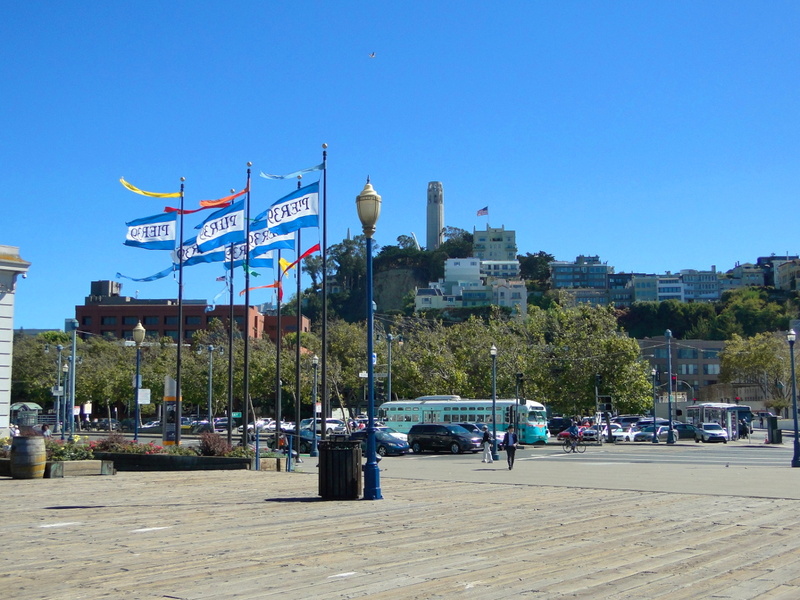 Vibrant San Francisco Waterfront with Flags and a City Skyline