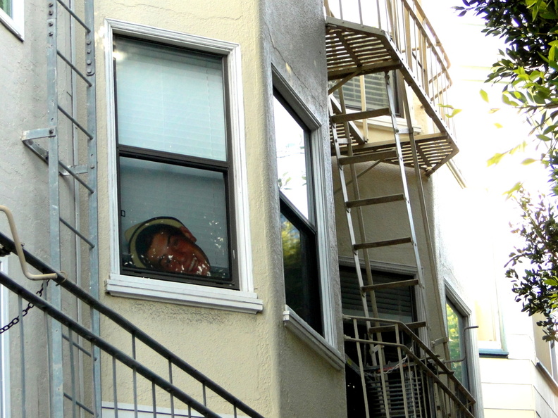 A collage capturing the essence of San Francisco's urban environment, featuring elements like residential buildings with fire escapes, a tree-lined street, and an iconic cityscape. DSC08905.JPG