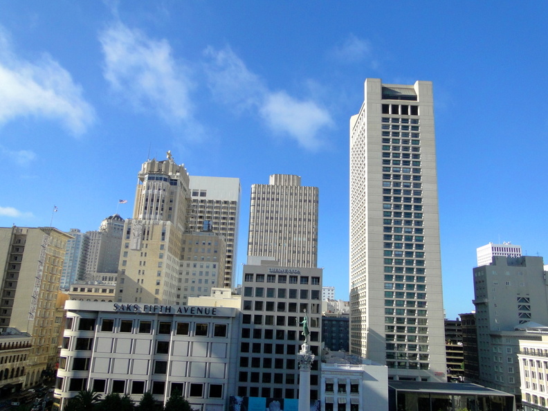 Aerial view of a bustling San Francisco neighborhood, featuring modern high-rise buildings and an iconic cityscape. The photo showcases the architectural diversity of urban spaces, with the juxtaposition of large, new structures next to smaller, older buildings indicative of the city's historical charm. DSC09102.JPG