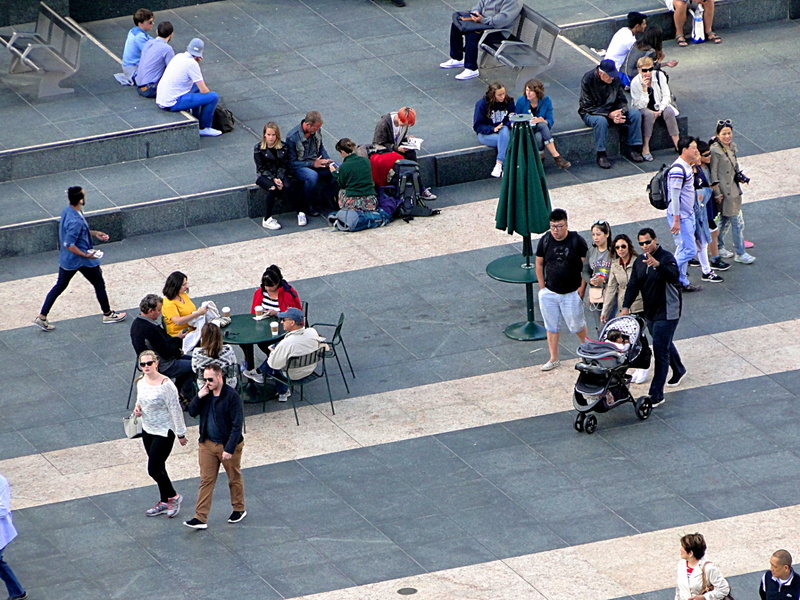 Bustling City Square with Pedestrians and Varied Activities