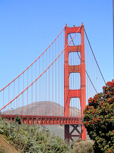 The Golden Gate Bridge, an internationally recognized symbol of San Francisco and California, spans the Golden Gate strait connecting San Francisco Bay and the Pacific Ocean. This image captures its striking red color against the backdrop of a clear day. DSC09151.JPG
