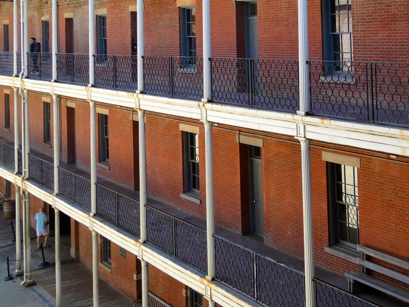 Old Red Brick Building with White Balconies