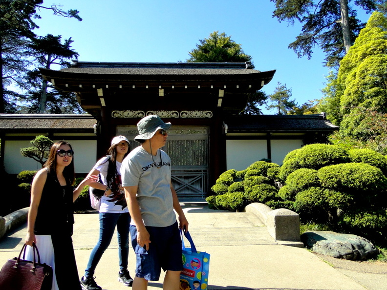 A family enjoying a sunny day at the historic Japanese Tea Garden in San Francisco, taking in the serene atmosphere and architectural beauty of the traditional pavilion. DSC09320.JPG