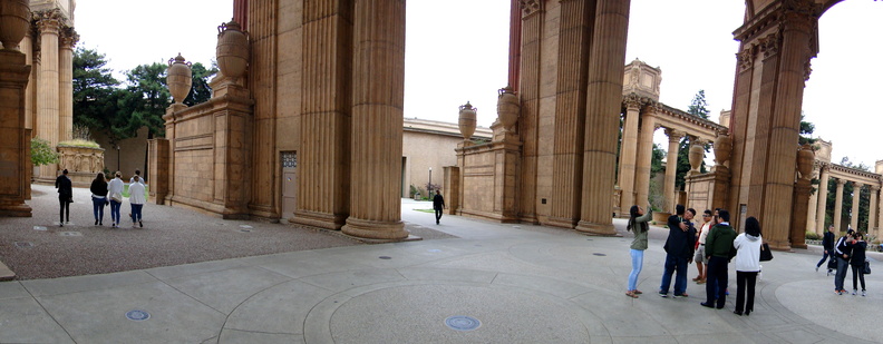 This image captures a scene of a group of people gathered in front of ancient Greek-style columns, which are part of a historic building. The architecture and setting suggest this location is in San Francisco, USA. DSC09854.JPG
