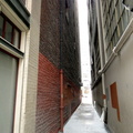Narrow Alleyway between Tall Buildings