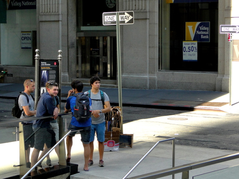 A Day in New York: Tourists and Locals at a City Corner