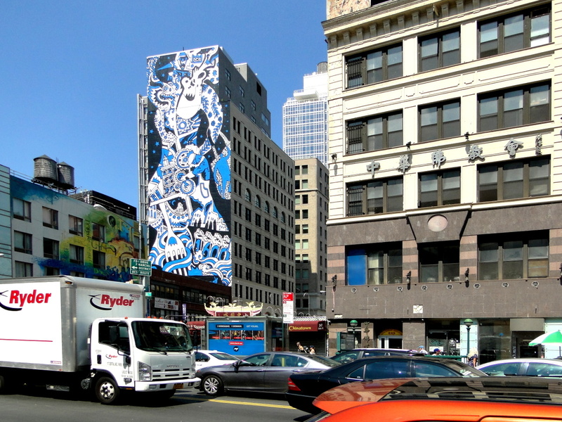Urban Vibrancy: A New York Street Scene with Murals and Graffiti on Buildings