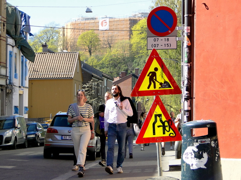 Intersection Signage on City Street with Pedestrians