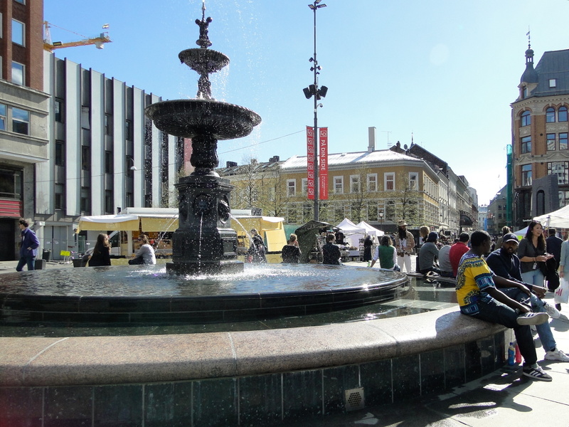 Urban Park Vista with Fountain and Pedestrians