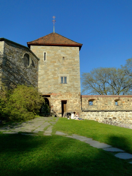 Historic Brick Tower with Stone Wall and Steeple