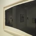 Framed Artwork with a Reflection