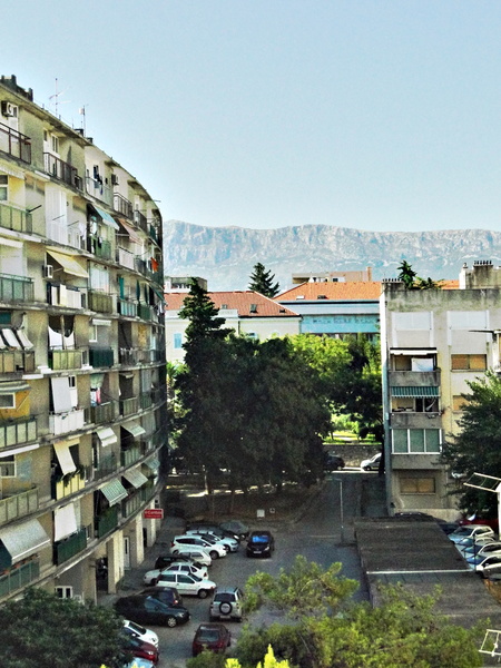Urban Apartment Complex with View of Mountains