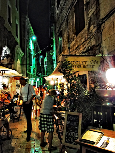 Night in Split, Croatia - A Vibrant City Street Alive with Dining and Social Activity