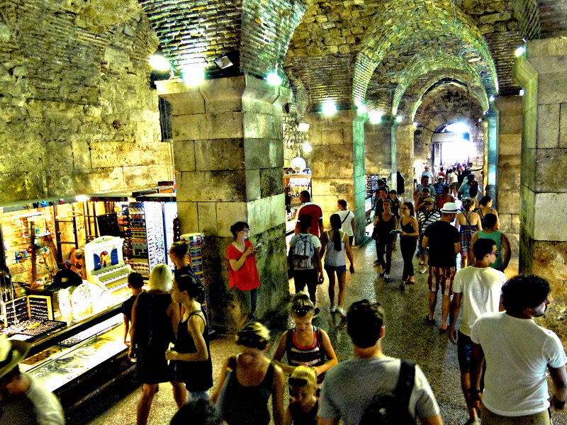 Vibrant Market Underneath Stone Archways