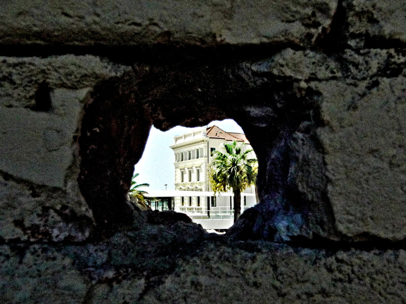 Peeking through a Hole in a Wall