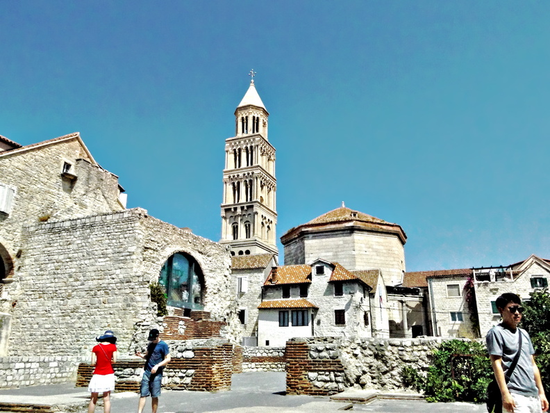 The image showcases the stunning architecture of the St. Francis Church amidst a lively city street. The church stands as a testament to Split's rich history and cultural heritage. DSC01840.JPG