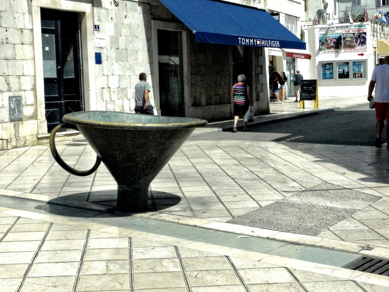 Roman-inspired Coffee Cup Art in European City Square