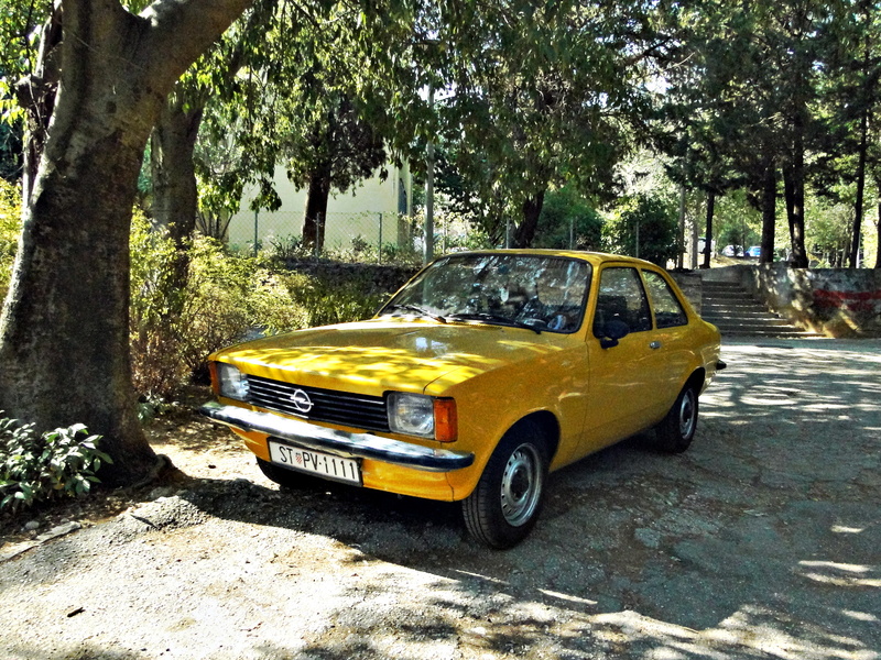 Vintage Yellow Car in a Parking Lot in Split, Croatia