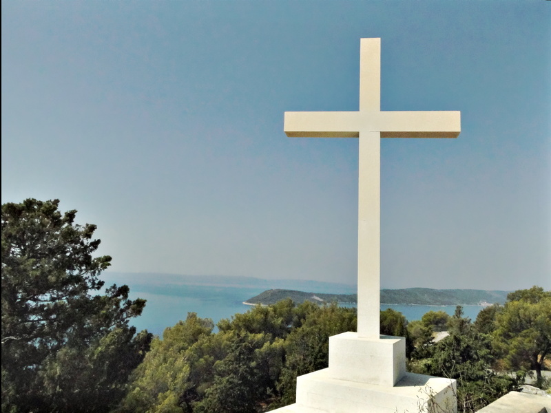 Stone Cross on a Hilltop Overlooking the Sea