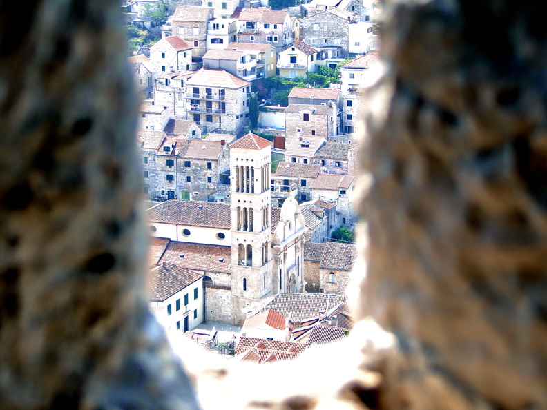 Hvar's Old Town through a Stone Window Frame