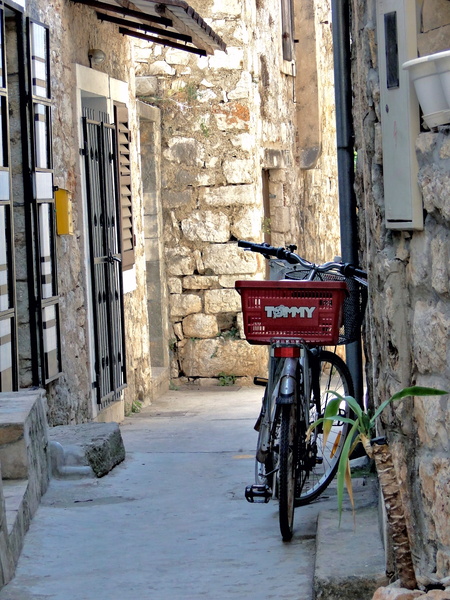 Narrow Alley in Stari Grad, Croatia - A quaint European street with a bicycle parked