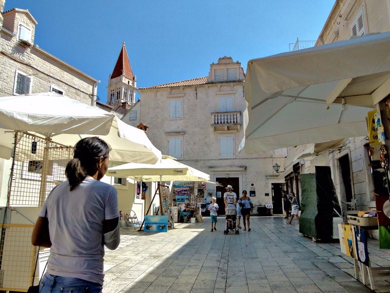 A Woman Exploring a Market in Trogir, Croatia
