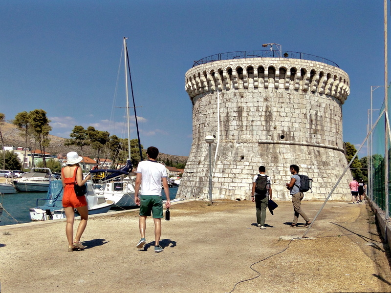 Group exploring the historic Fort of Trogir, Croatia