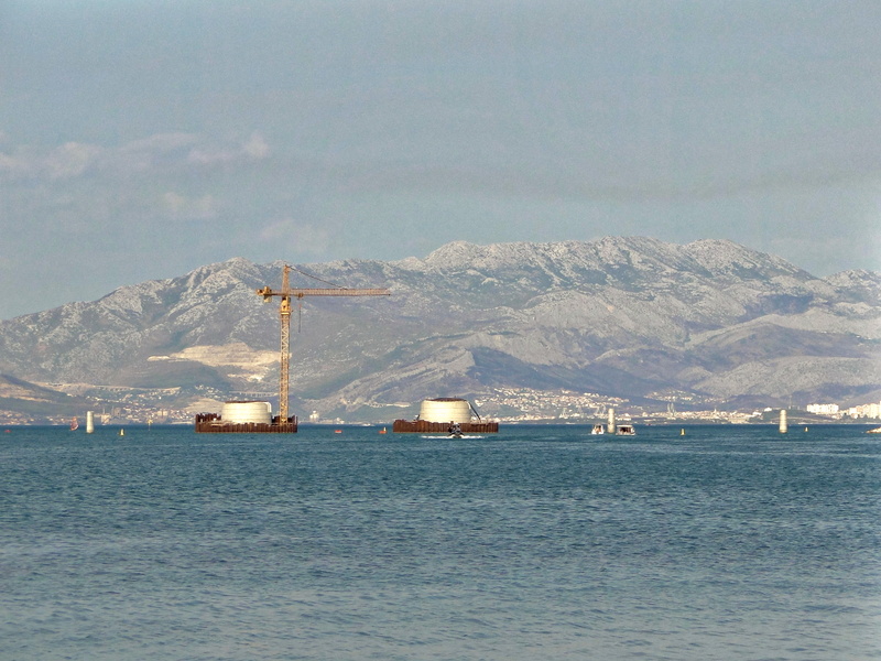 Trogir Harbor with Crane and Mountains