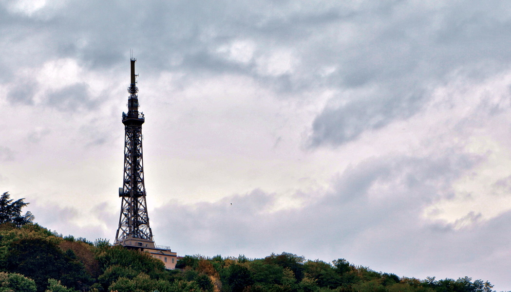 Silhouetted Tower Against Stormy Sky