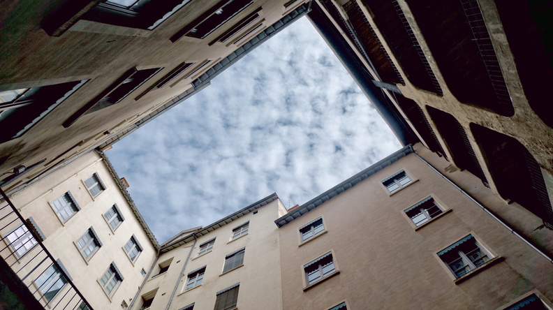 Rooftop View from a Narrow Alley