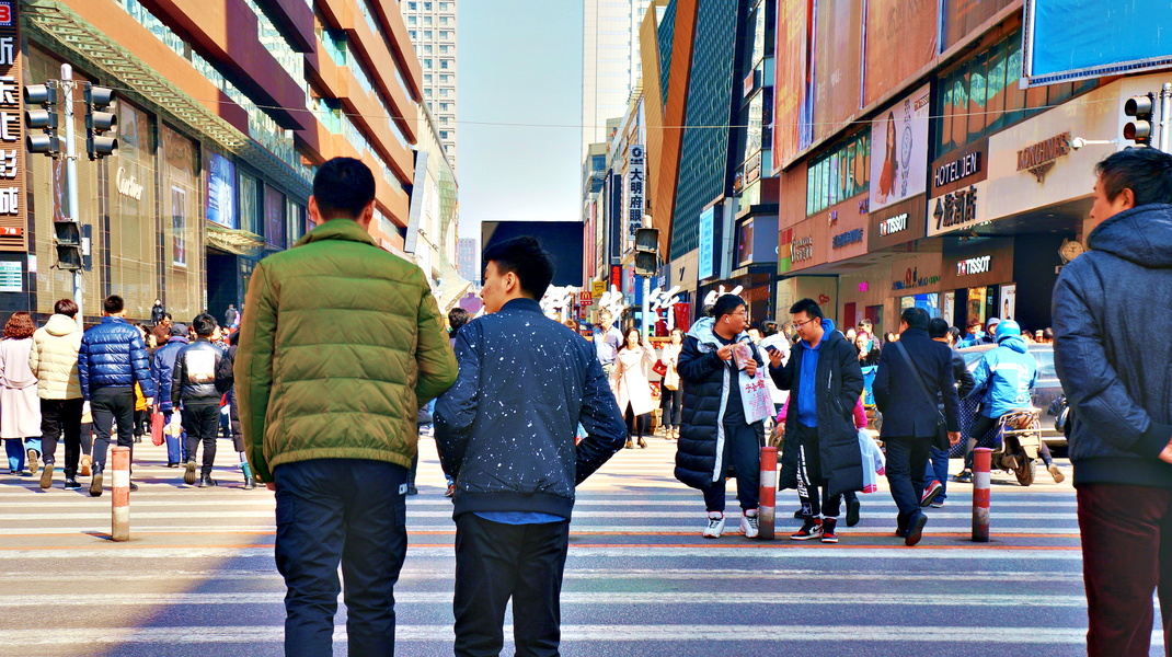 Family Walking in a Busy Chinese City Street