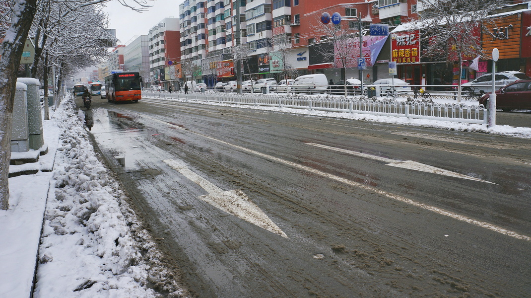 A Slushy City Street on a Winter Day