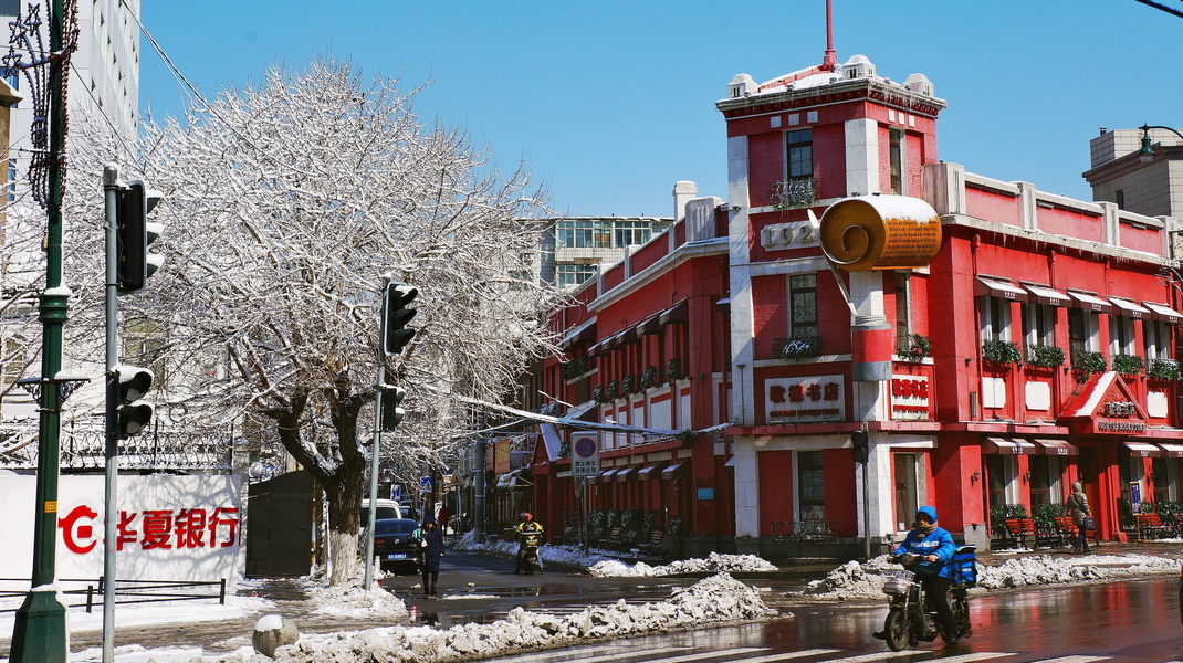 A Snowy Winter Scene in Shenyang, China with a Red Shopping Center