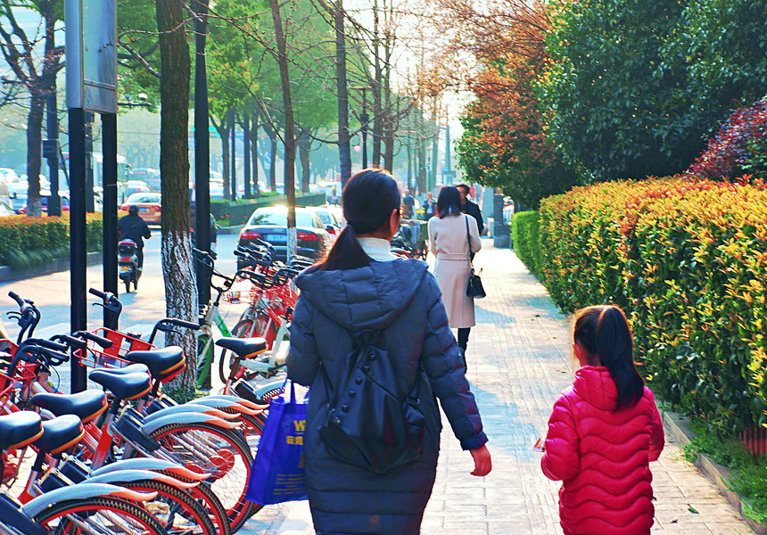 Mother and Child Enjoy a Sunny Day in the City