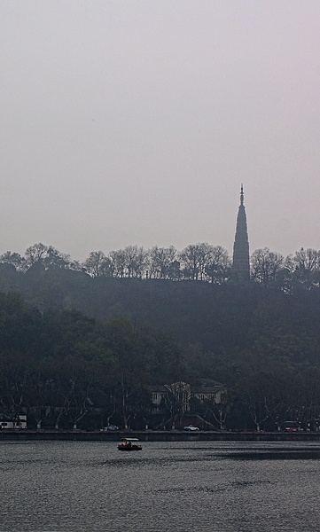 Hangzhou Skyline with a Foggy Lake and Tower in the Background
