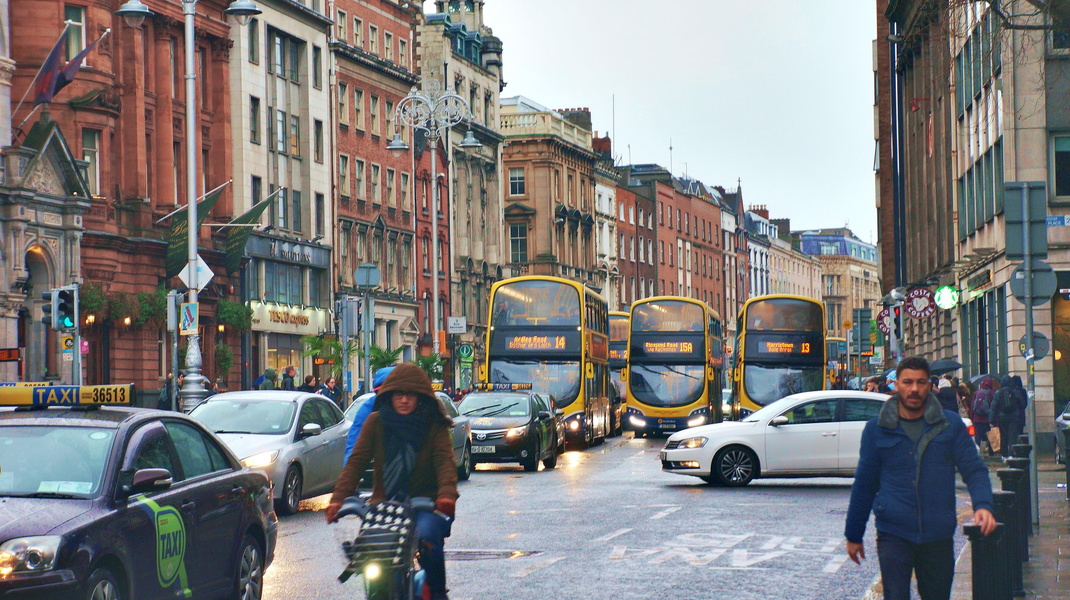 Bustling Dublin Street: A Snapshot of Urban Life in the Rain