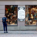 A Tourist Explores a Shop Window in Stockholm