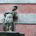 Historical Statue on Old Building Wall