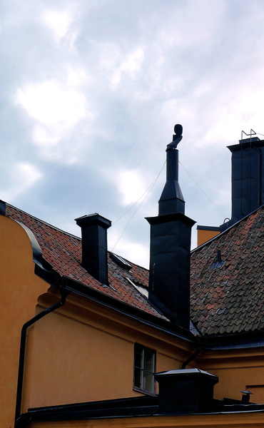 Stockholm Skyline with a Chimney and Church Tower