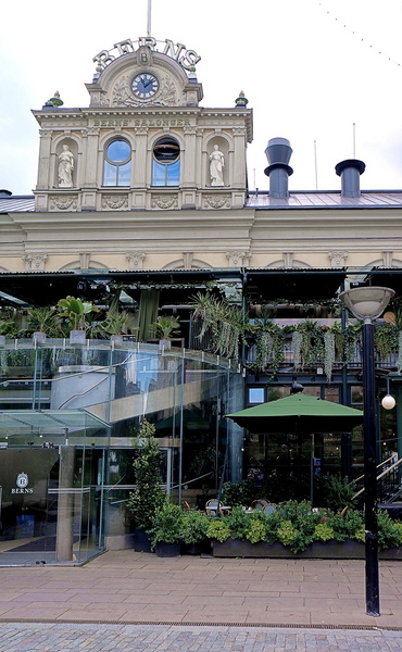 Elegant European Facade with Stoa and Outdoor Dining Area