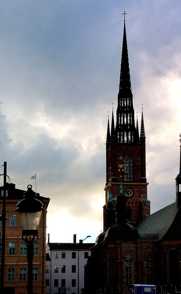 Historic Church in Stockholm, Sweden - A Gothic Architectural Landmark Amidst Cloudy Skies