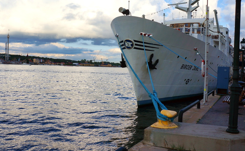 Harbor Scene with a Docked Ship