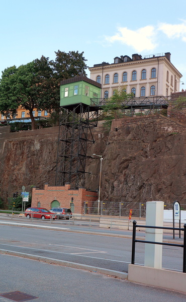Historic Building and Rock Wall in European Cityscape