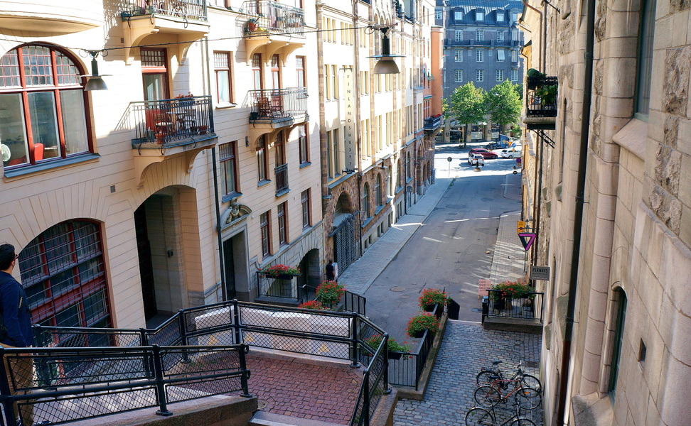 Narrow European Street with Balconies and Stairs