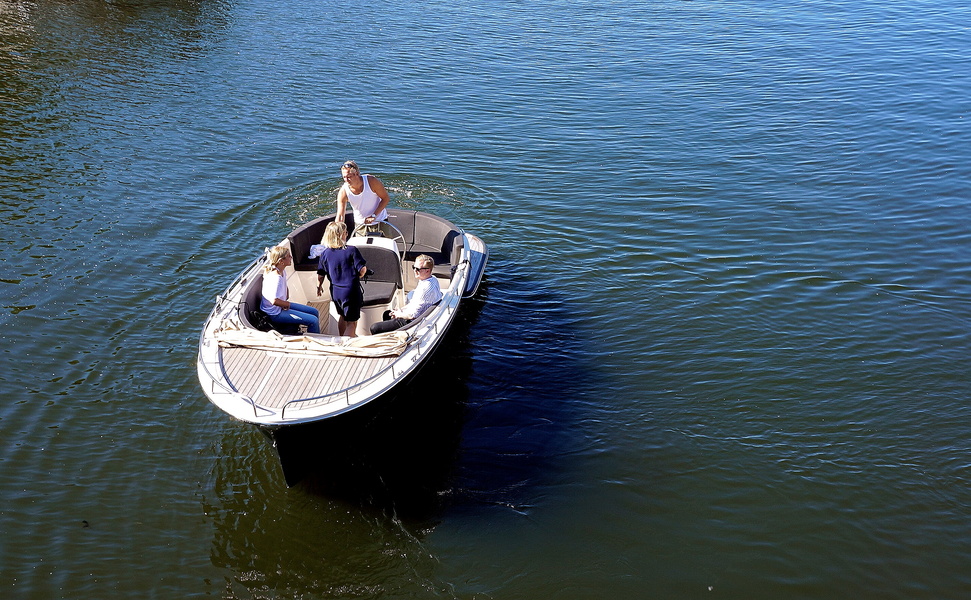 Serene Scene of a Couple Enjoying a Lake Cruise