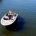 Serene Scene of a Couple Enjoying a Lake Cruise