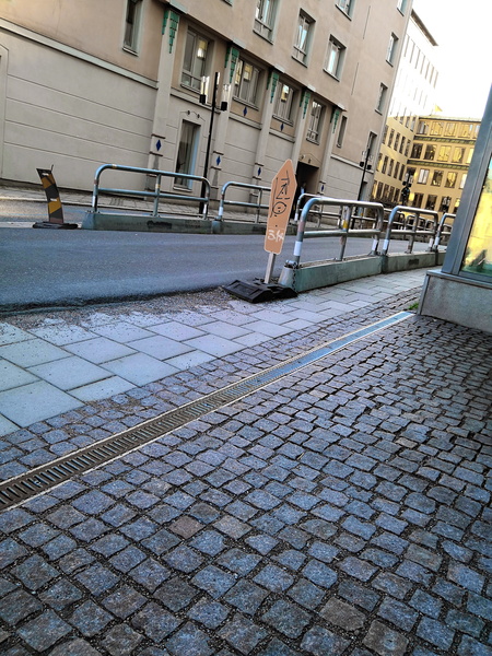 A Rainy Day in a European City: An Empty Street and a Wet Sidewalk