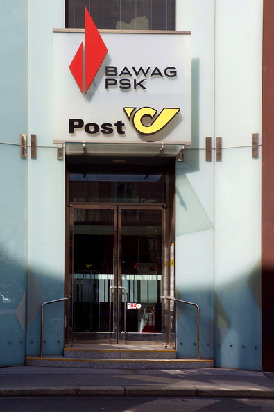 This image showcases a local postal office, which is a common sight in many European cities. The signage on the building indicates that it serves as a place to send and receive mail, suggesting an active role in communication within this urban setting. DSC09298.JPG