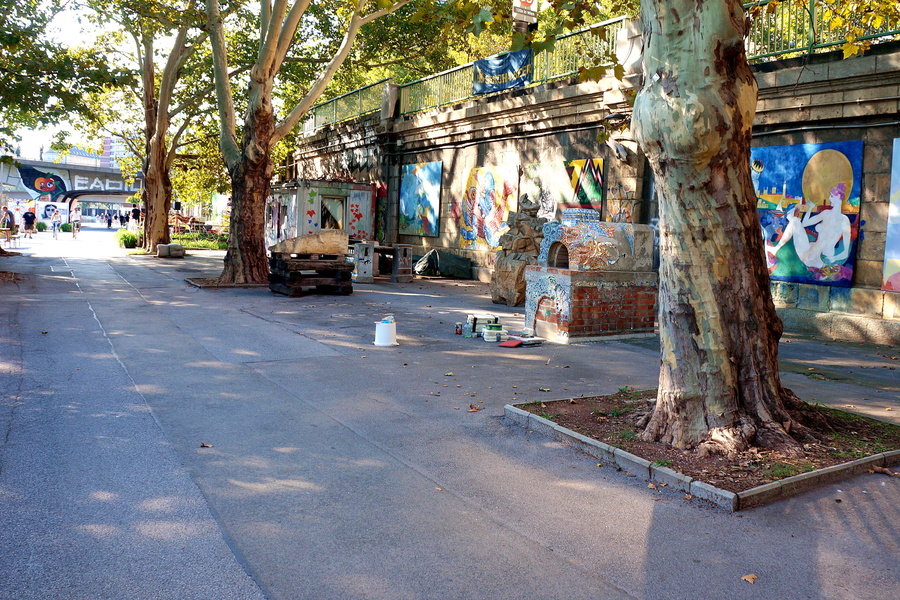 A quiet, graffitied street alley