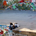 Casual Gathering in a Graffiti-Laden Public Area